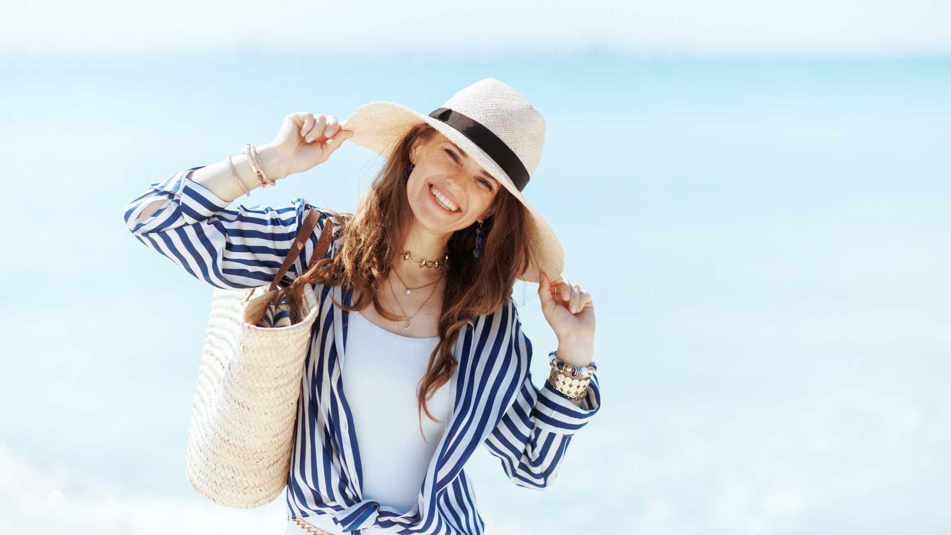Beautiful 50 plus lady aging gracefully by the beach - wellness beyond 50